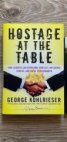 Hostage at the Table