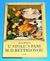 U stolu s paní M.D. Rettigovou